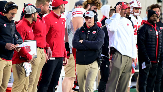 Wisconsin interim head coach Jim Leonhard walking on the sidelines.
